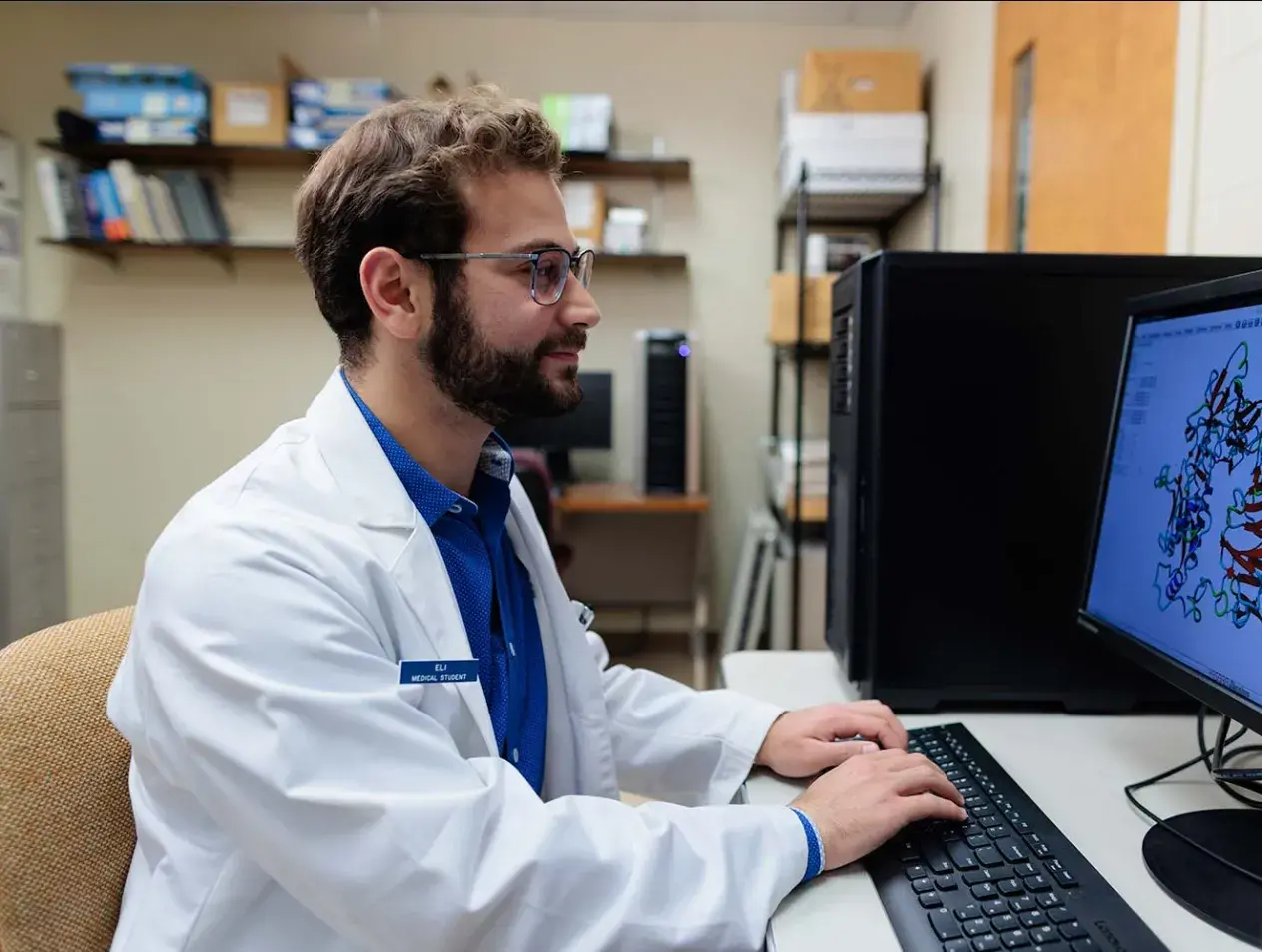 Medical student performing research on computer