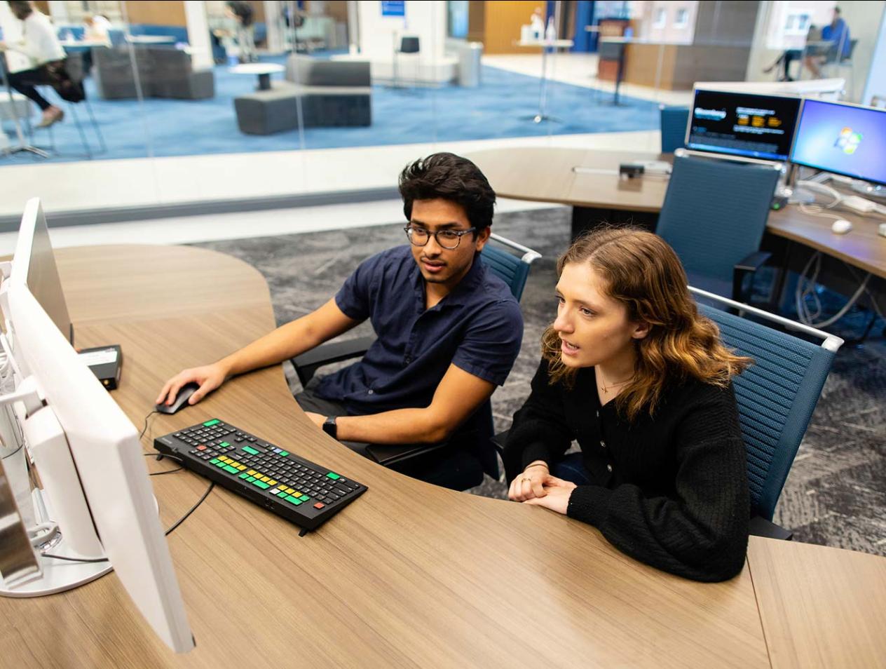 Business students working at computer