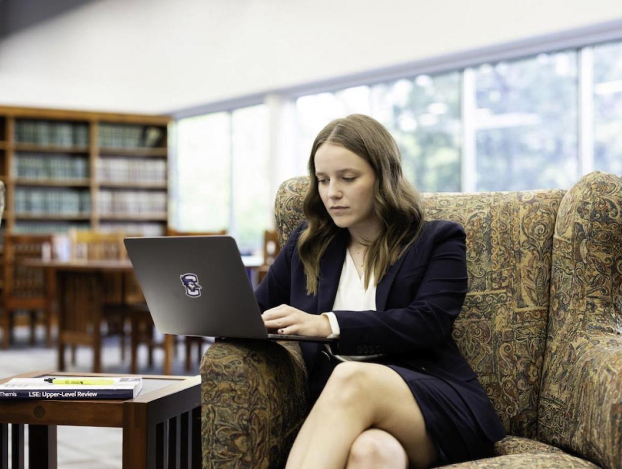 Female student in Law Library studying