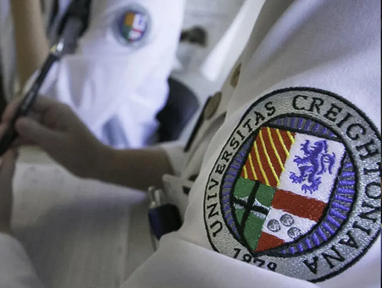 White coat Creighton badge