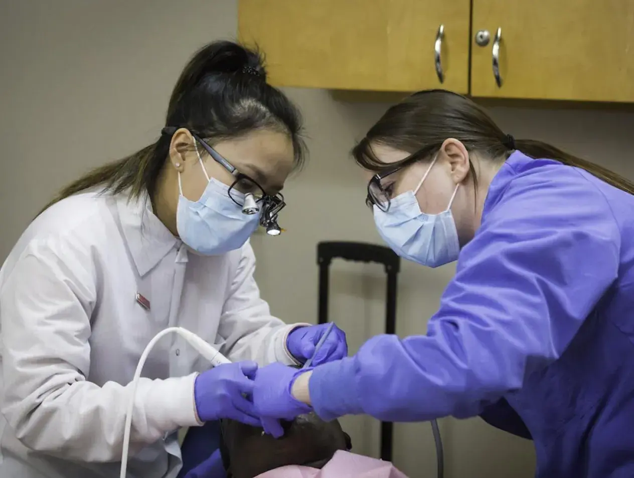 Patient having work done on their teeth at Creighton