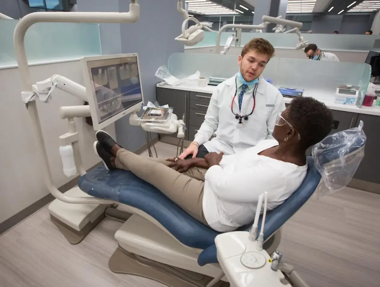 Dental student with patient