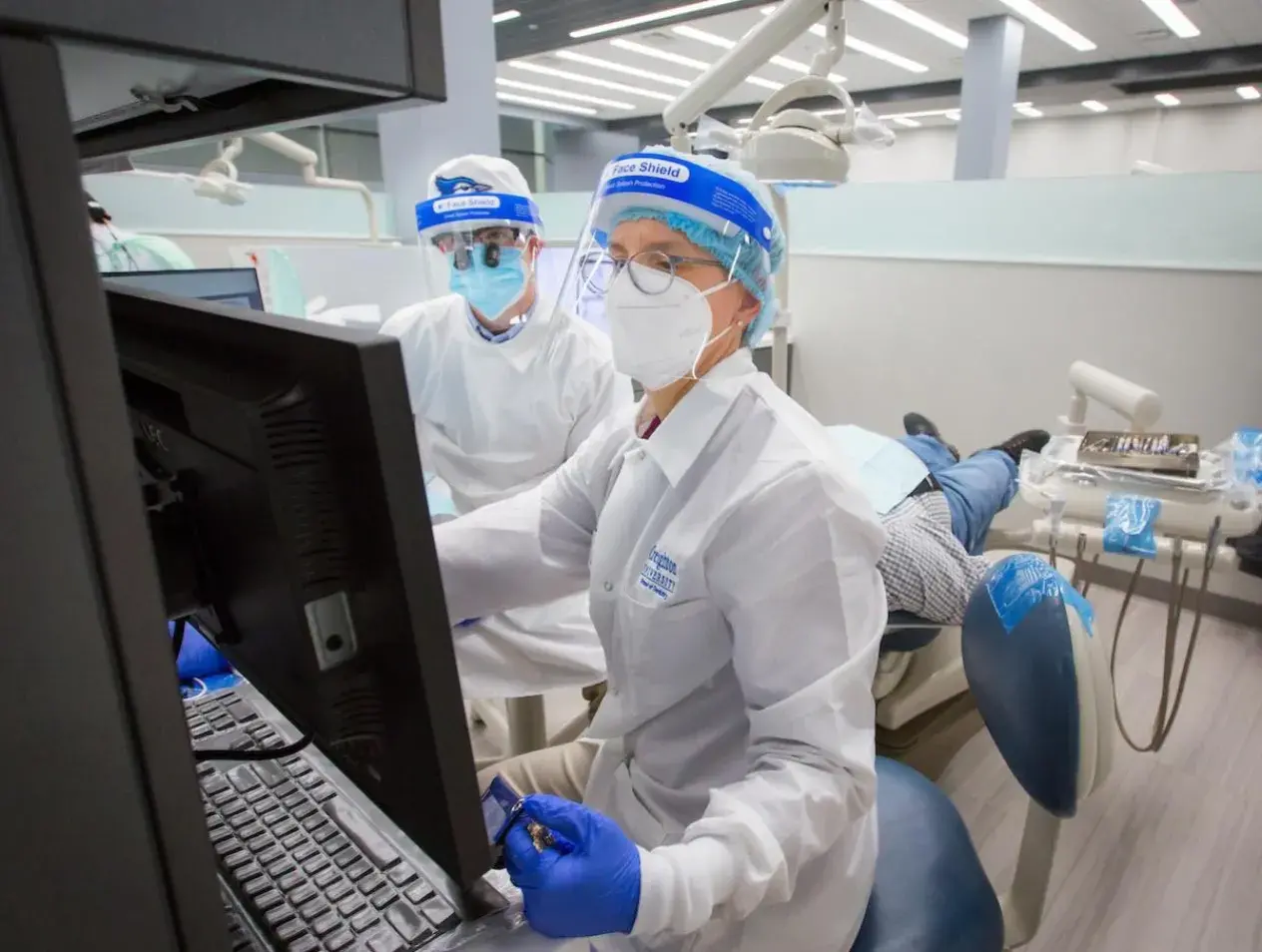 Dental technicians at work station