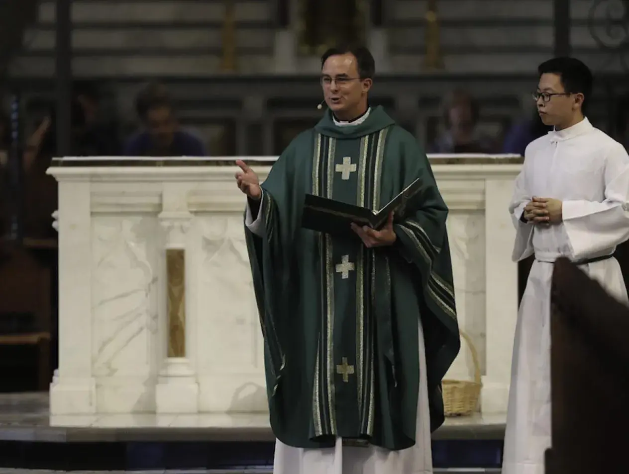 Father Hendrickson delivering mass.