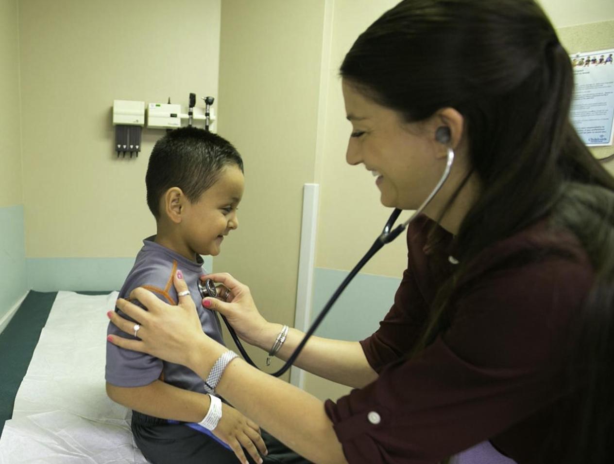 Pediatrician with patient