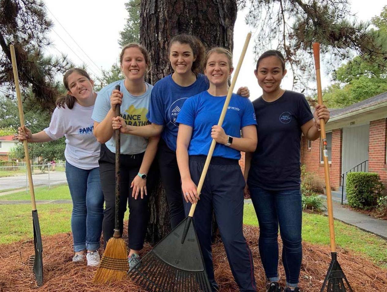 Students serving through community clean up