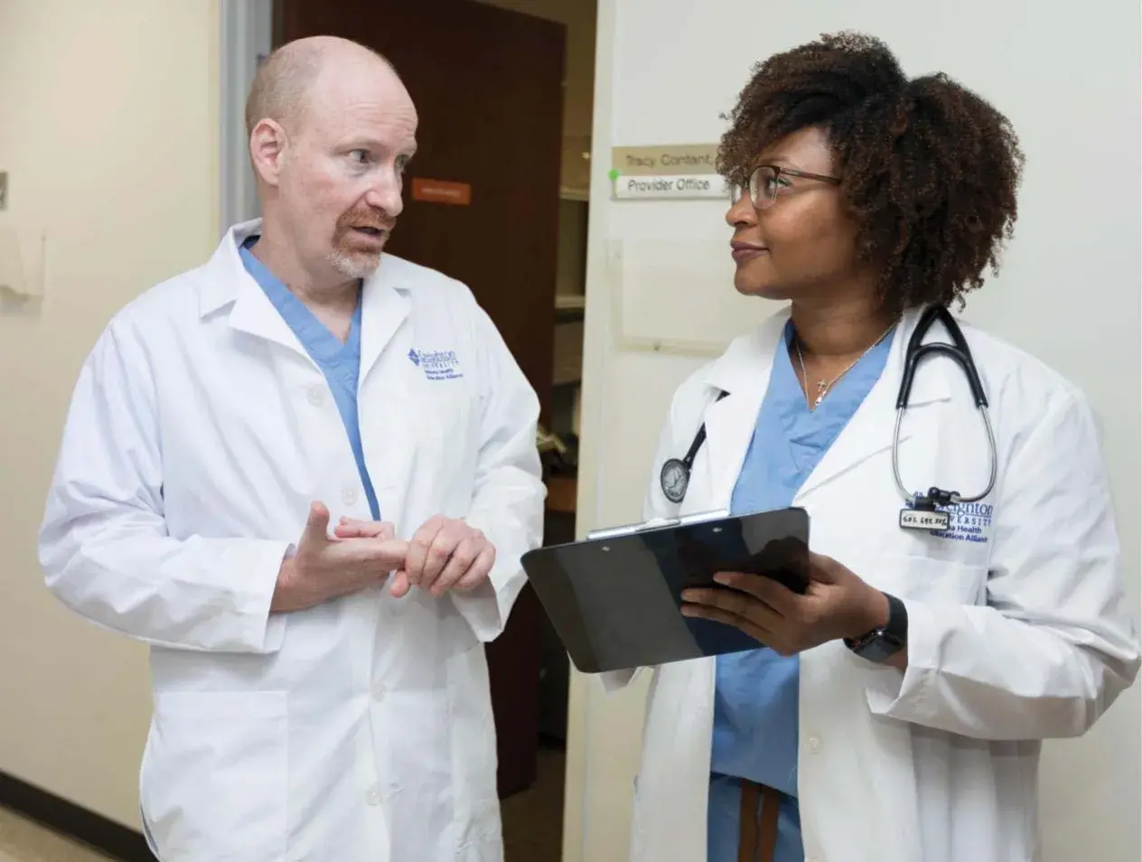 People talking in white coats