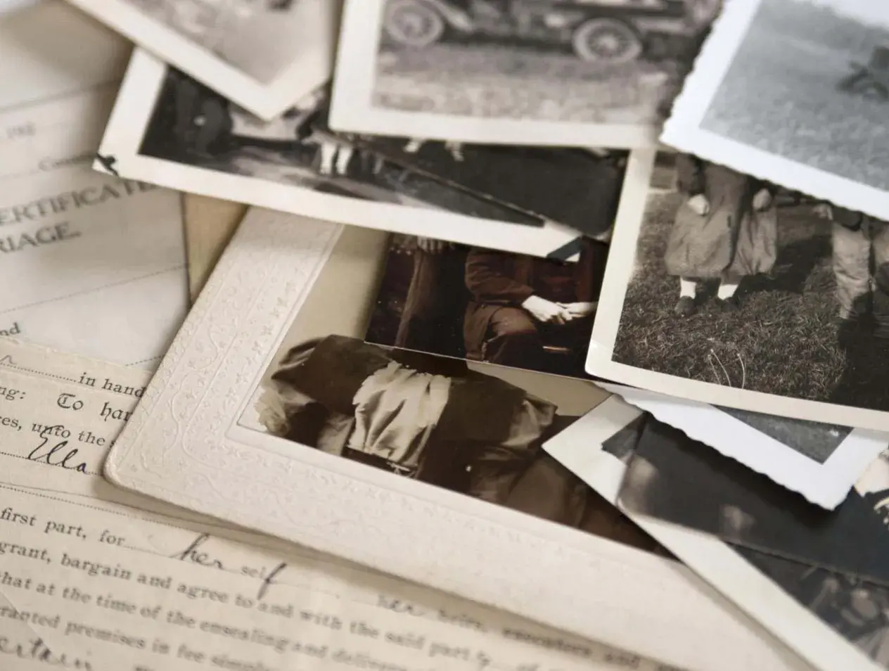 Assortment of old stacked black and white photos