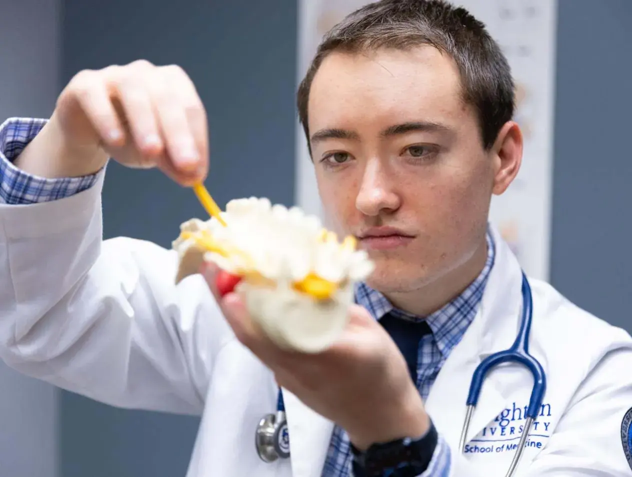 male medical student experimenting