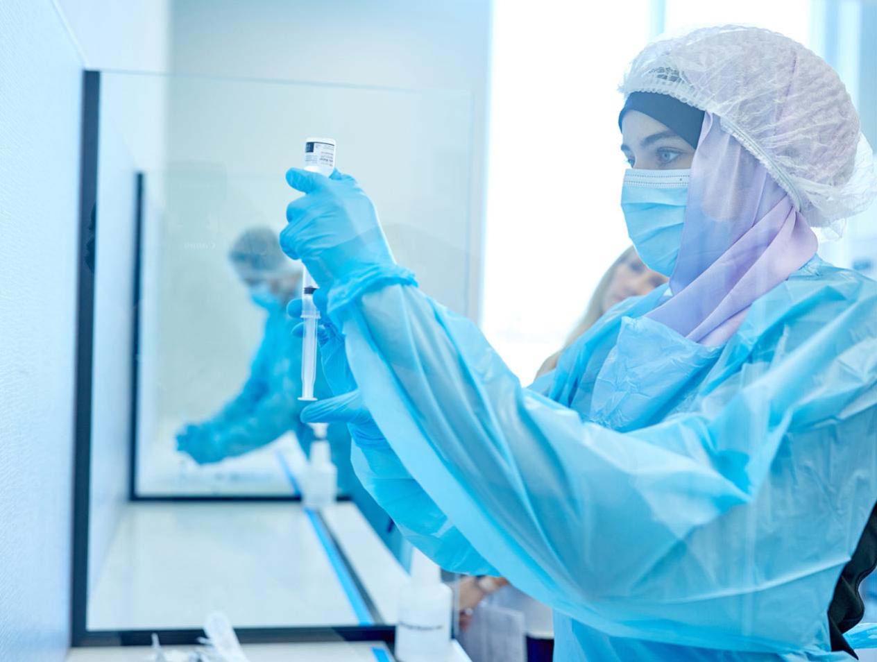 student in lab in protective gear
