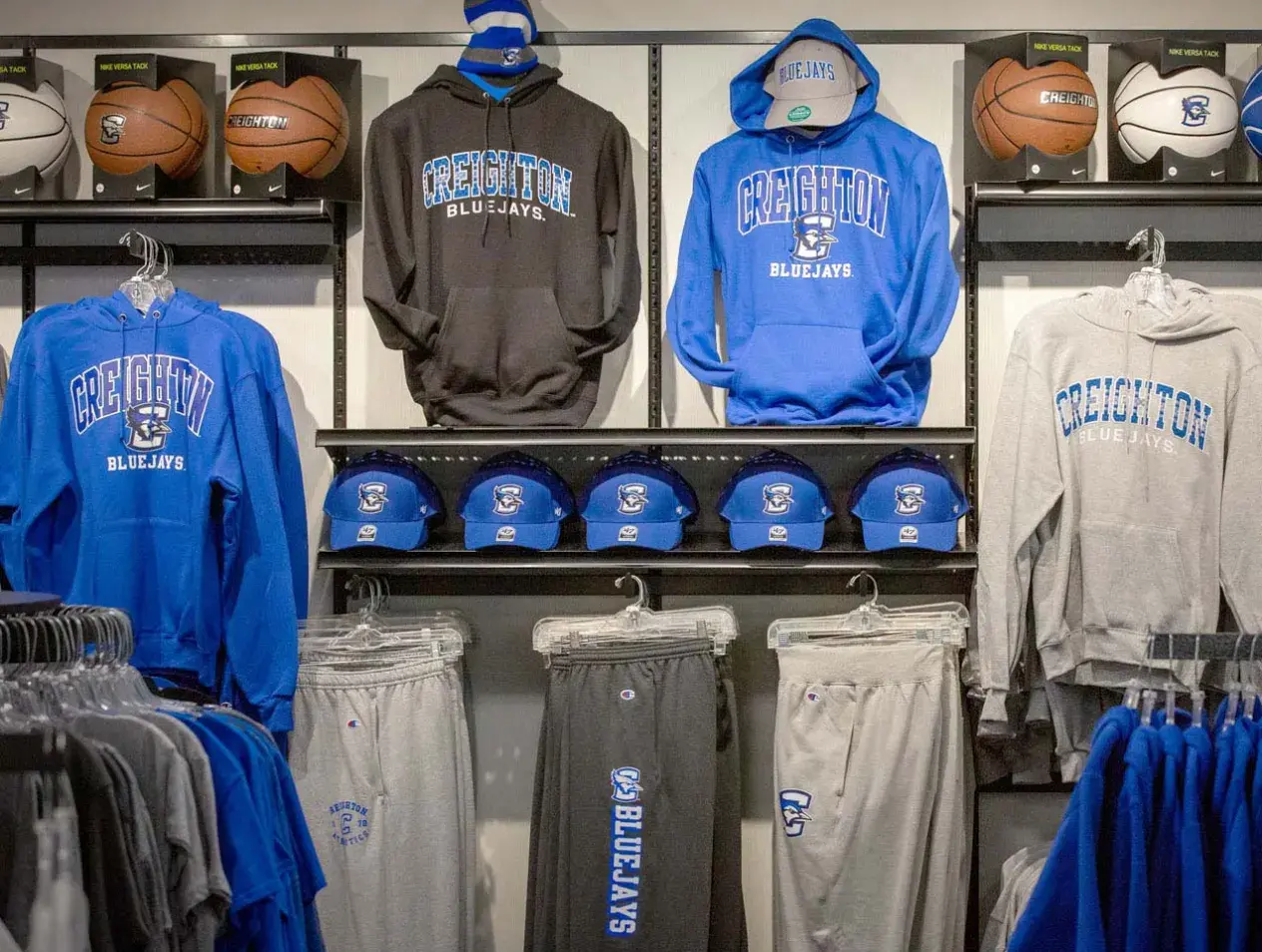 Creighton sports gear in shop setting.