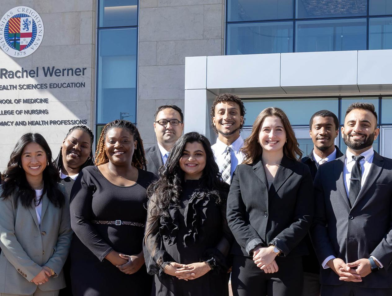 Students in group photo in front of Werner building 