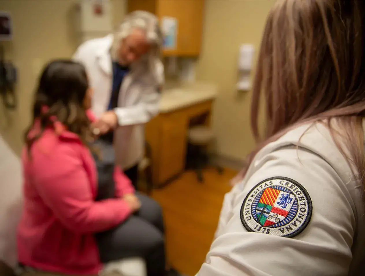Infectious Diseases fellow and faculty in clinic