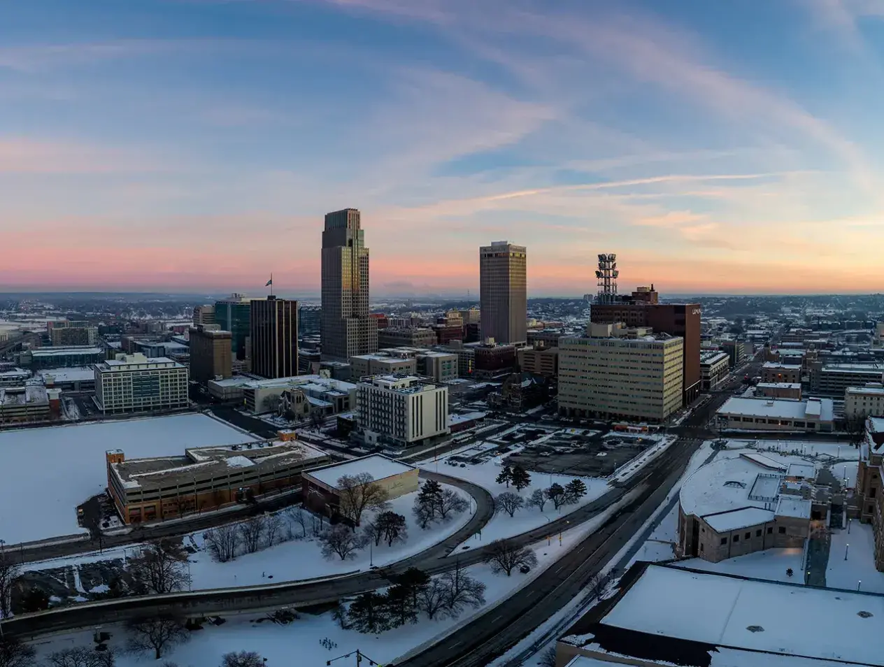 Winter panorama of downtown Omaha at sunset.
