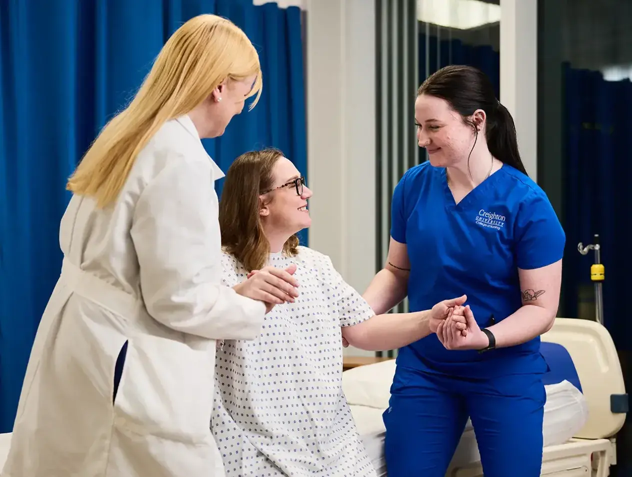 Nursing students helping care for patient