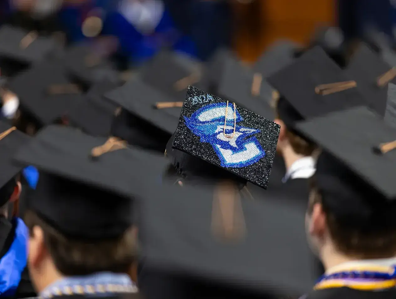 Commencement showing student graduation caps.