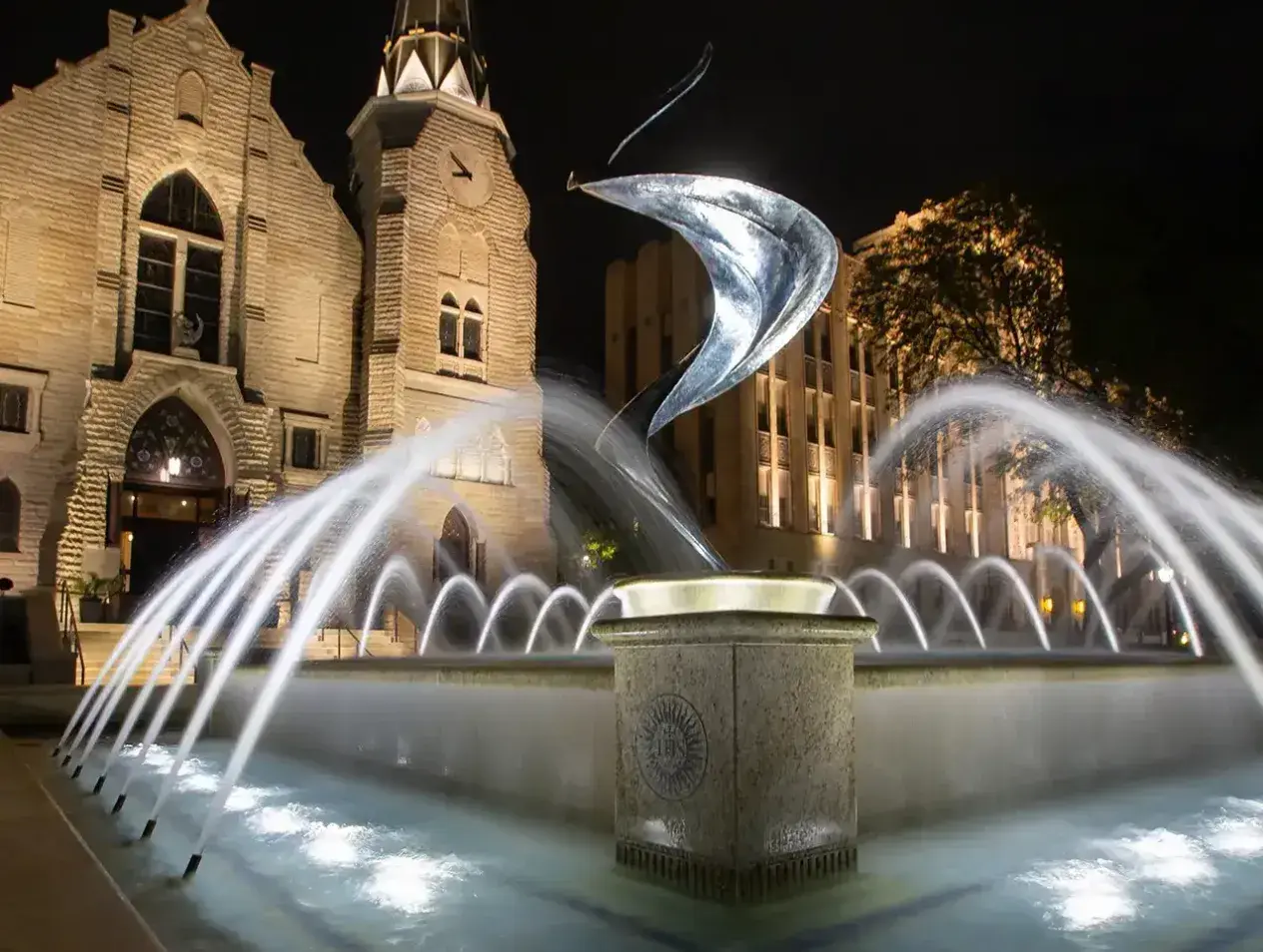 Fountain outside St. John's church at night.