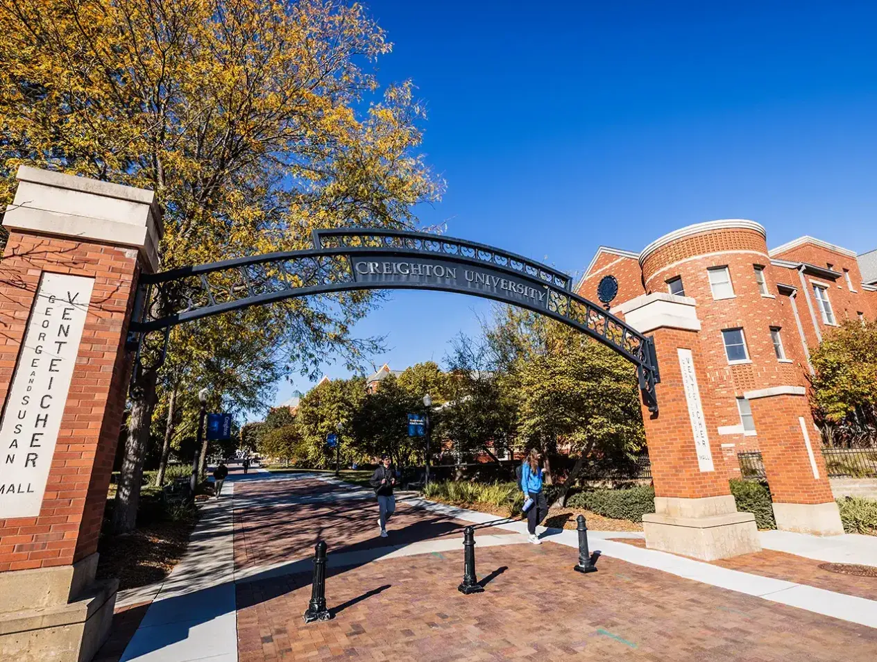 Creighton campus archway on sunny day.