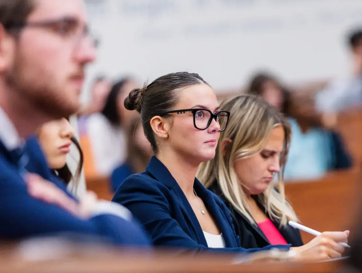 Students in court classroom taking notes.