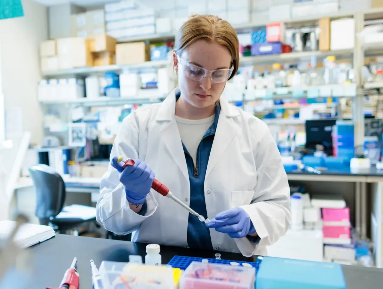 Medical researcher in lab setting.