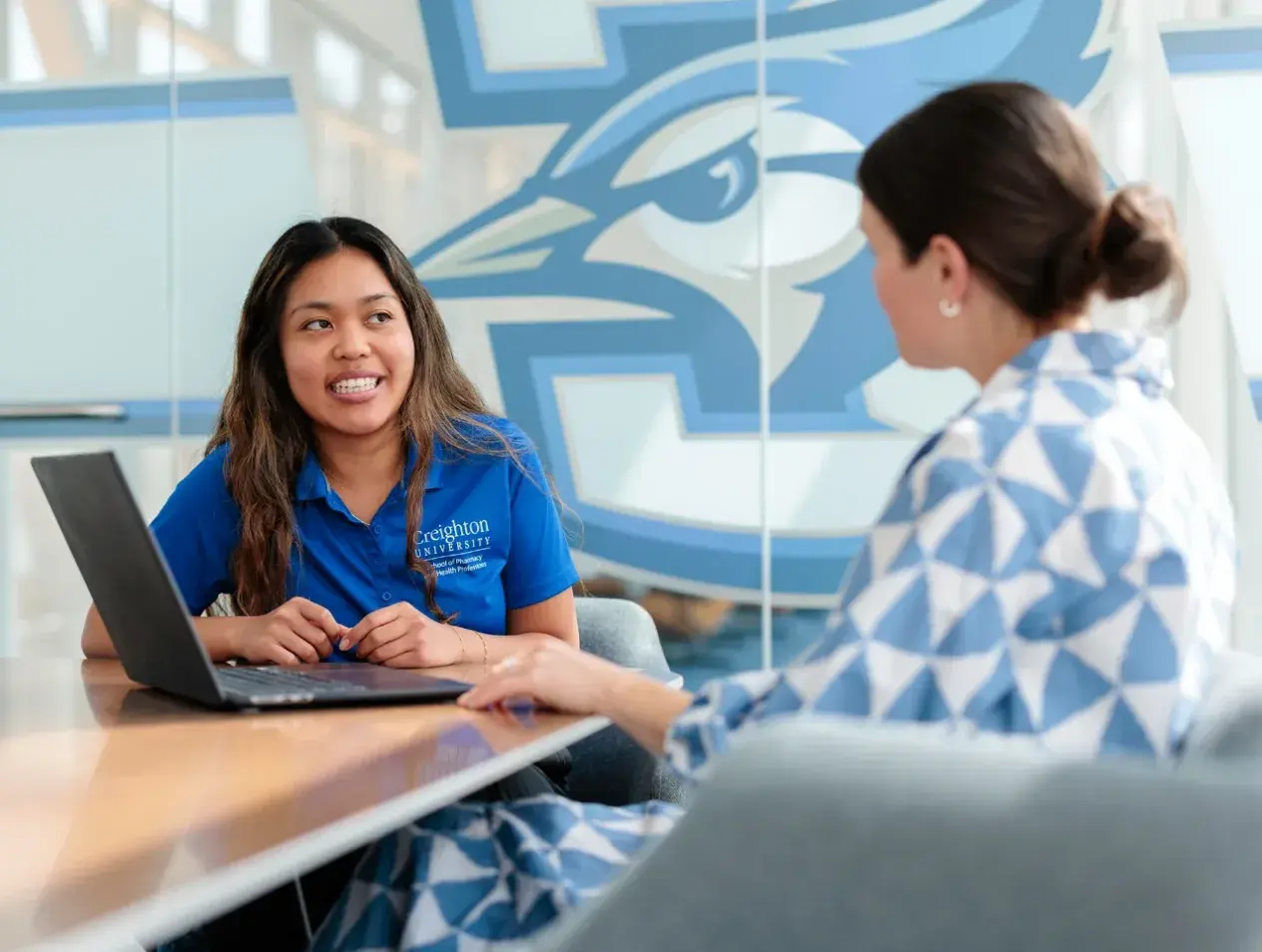 Student receiving guidance at Creighton.