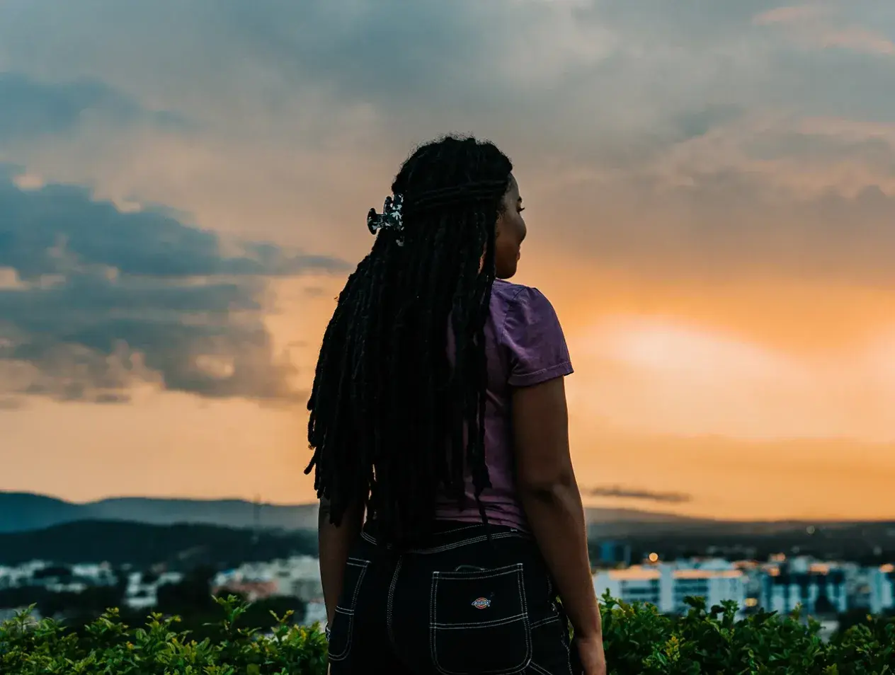 Student traveling abroad in early morning light.