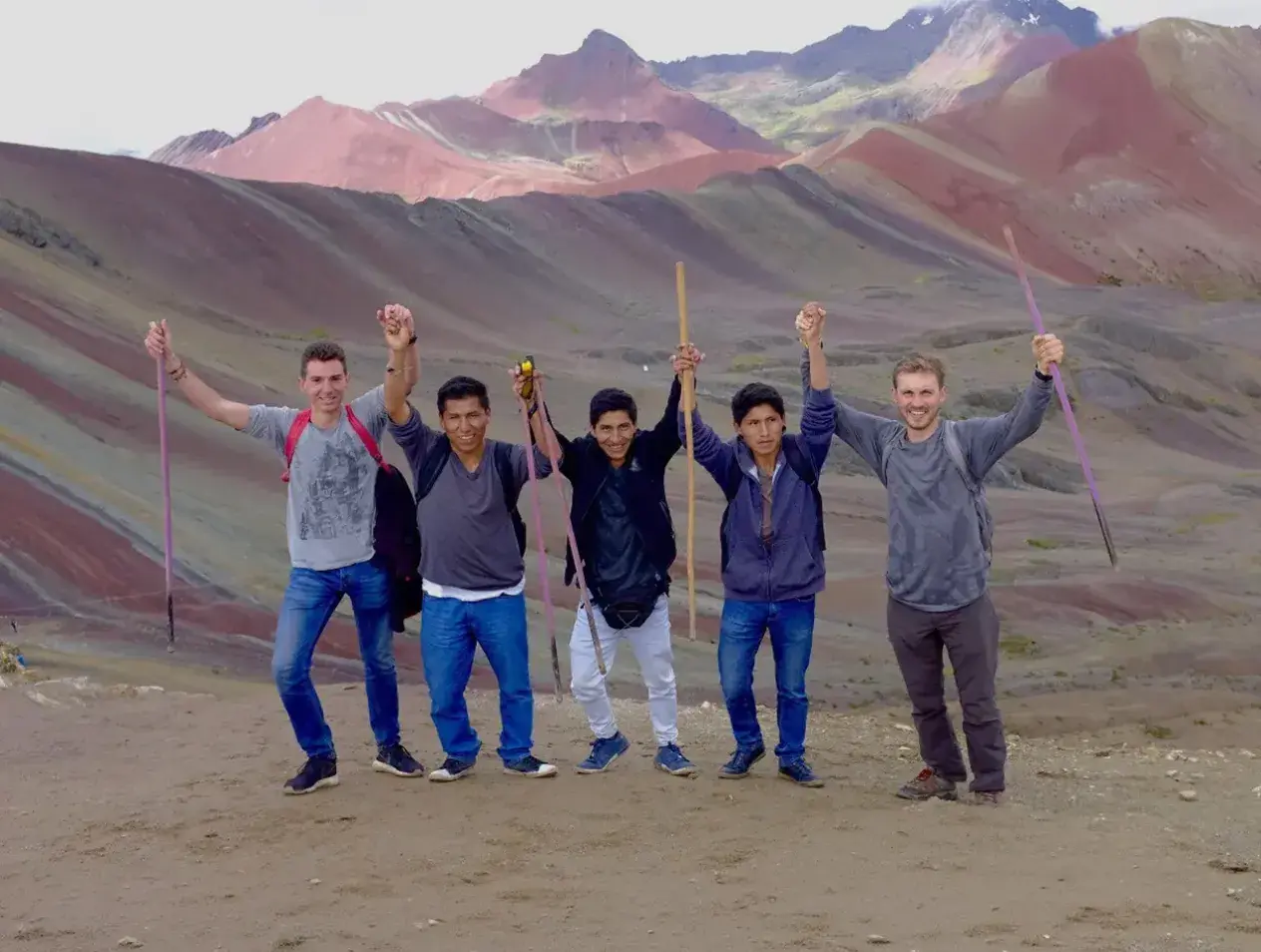 Five Creighton students abroad in rural mountainous setting.