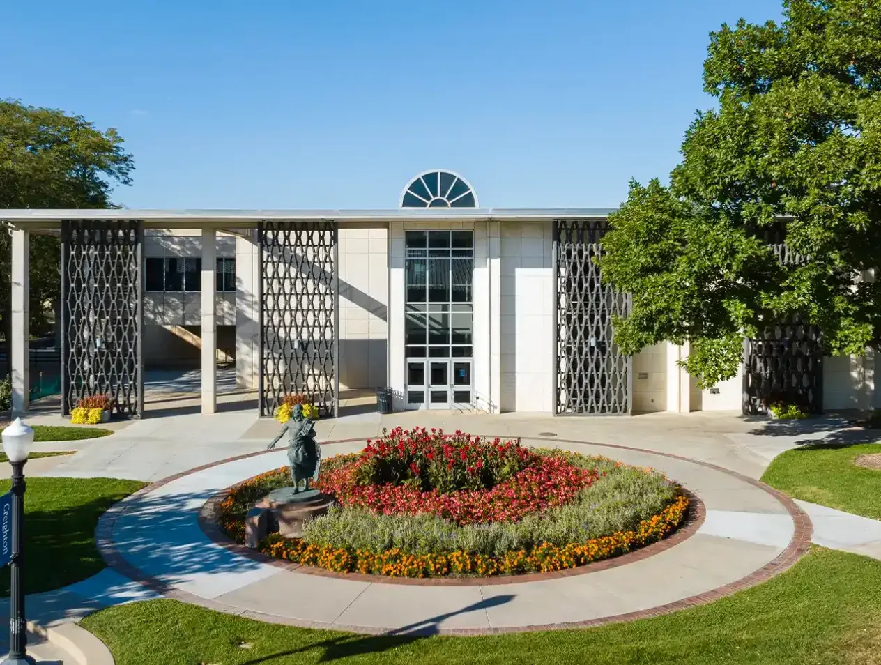 Exterior shot of Creighton Library including summer garden area.