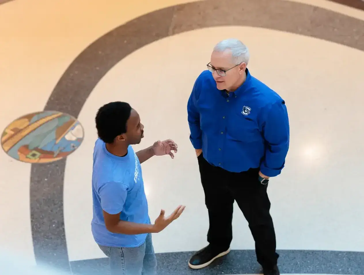 Student speaking with professor at Creighton.