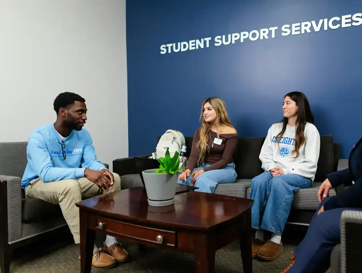 Students sitting in Support Services waiting area.