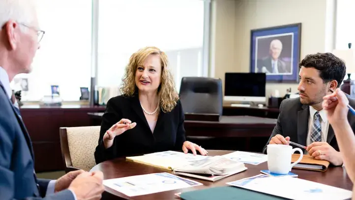 Leaders meeting around a table
