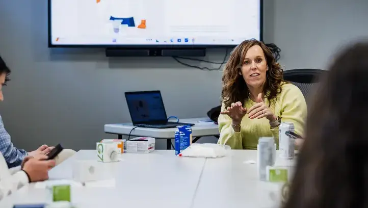 Emily Knezevich talks with students