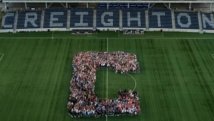 Creighton stadium with new students congregated into the letter C.