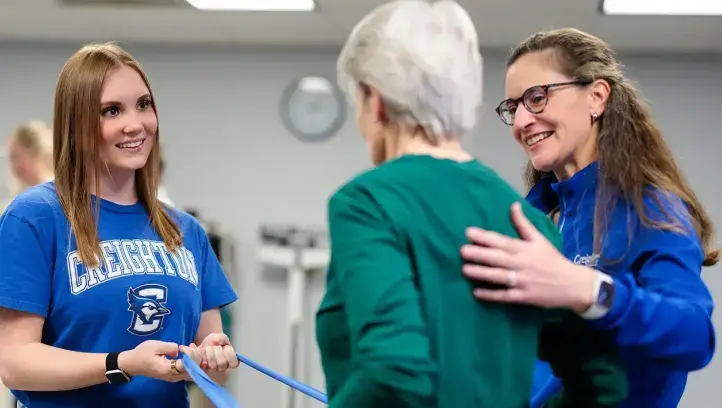 Occupational therapist works with patient.