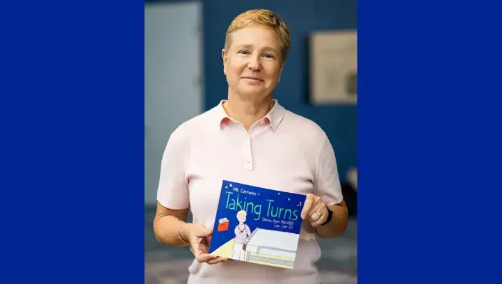 MK Czerwiec holding their book