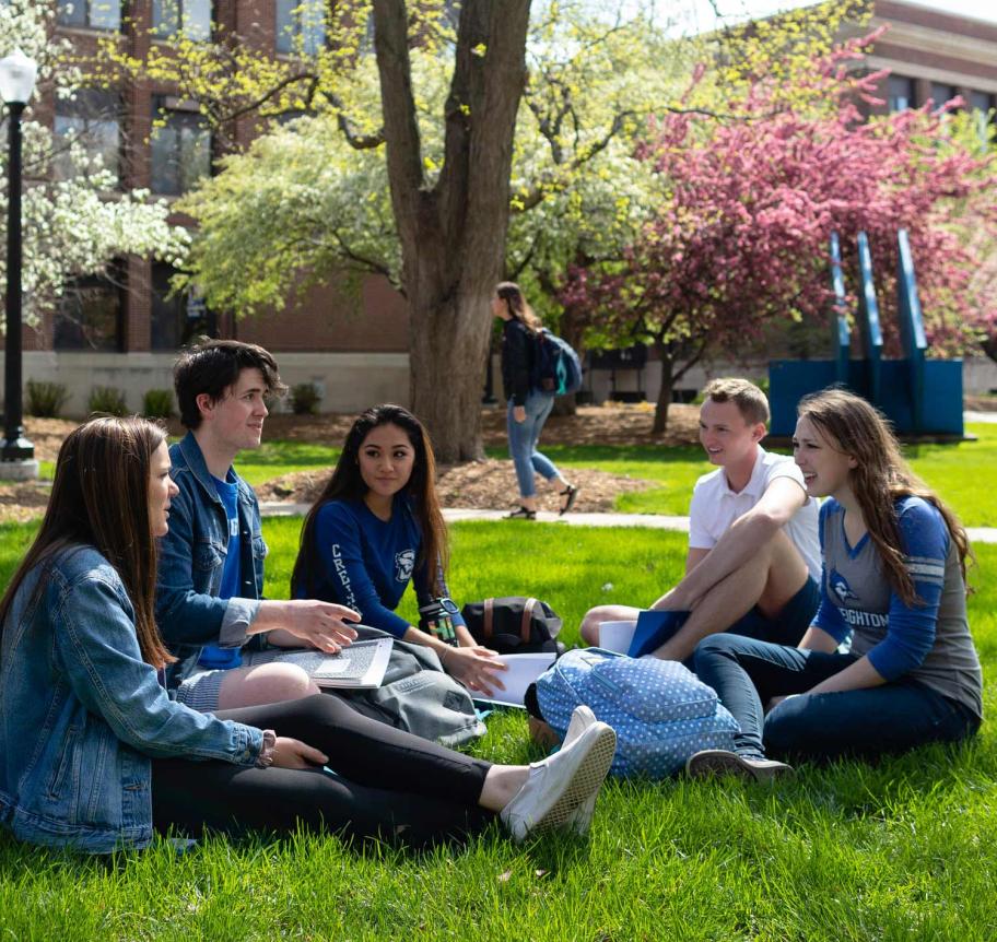 Students gathering outdoors on Creighton campus Thumbnail