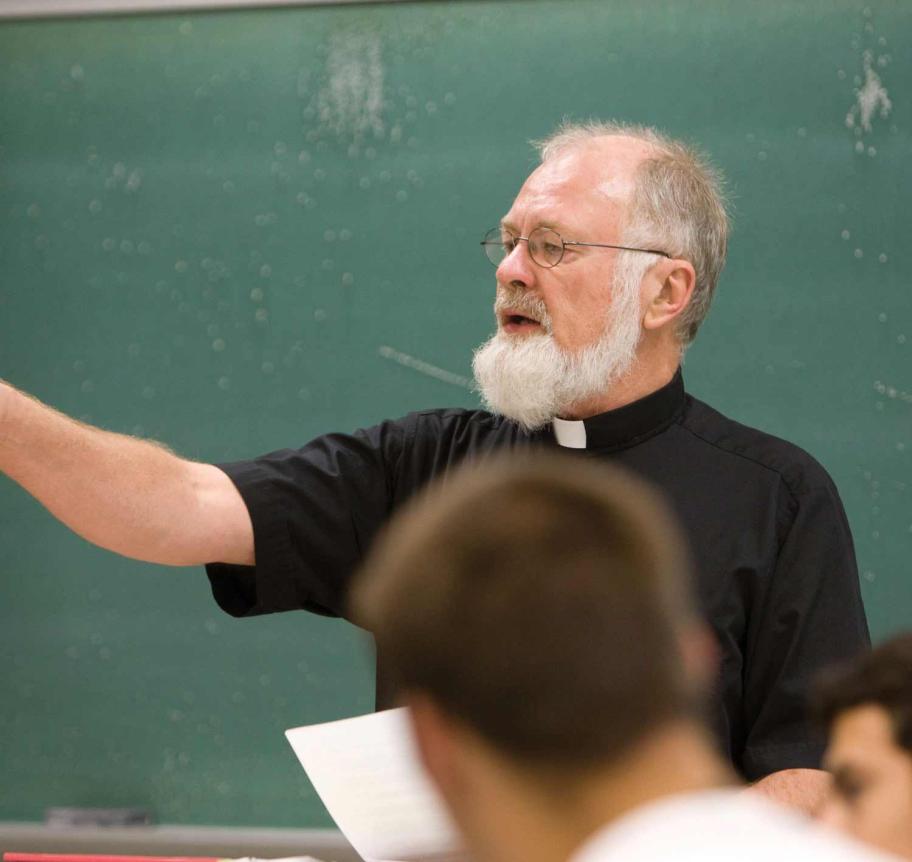 Jesuit professor teaching in class