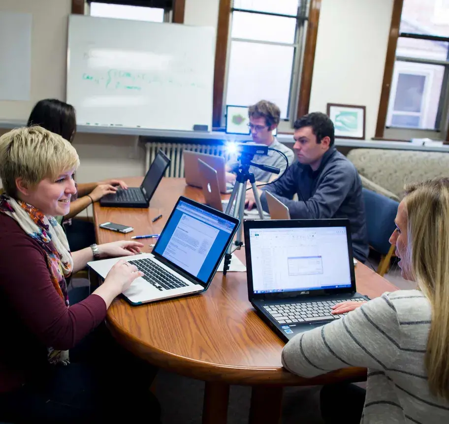 Faculty and students in discussion during class