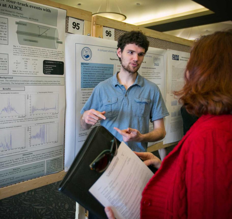Physics student presenting research
