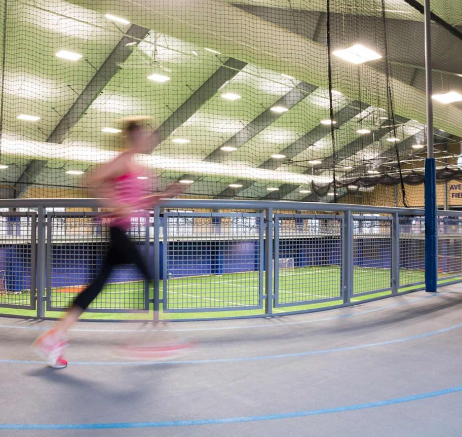 Woman running on indoor track