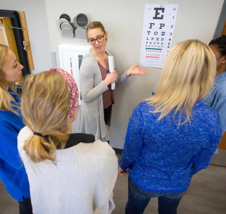 Occupational therapy students learning about eye testing