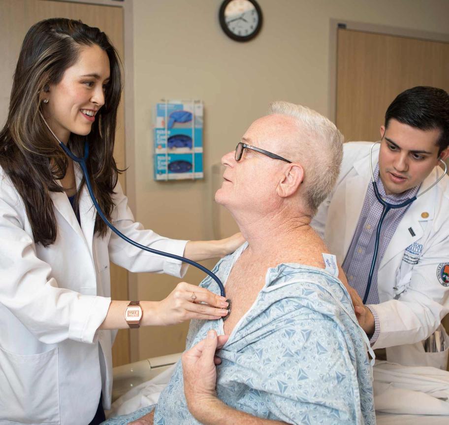 Physician assistant student working with patient