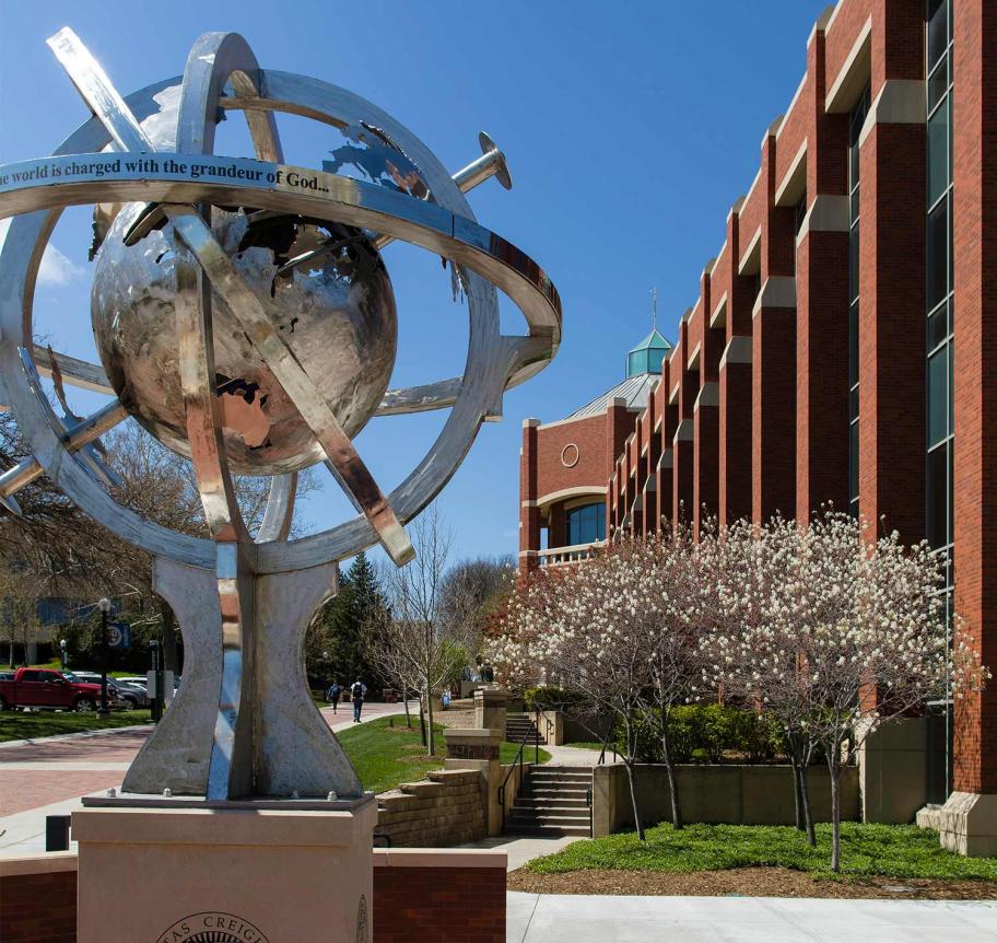 Globe statue ourside of Heider College of Business