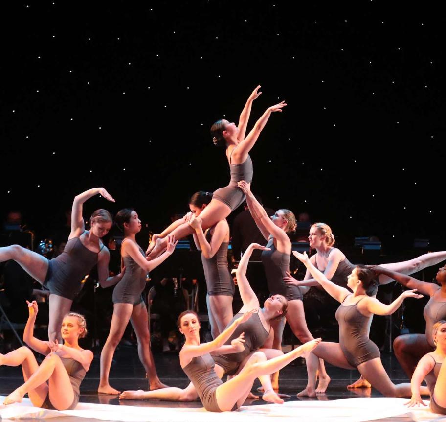 Large group of dance students in performance