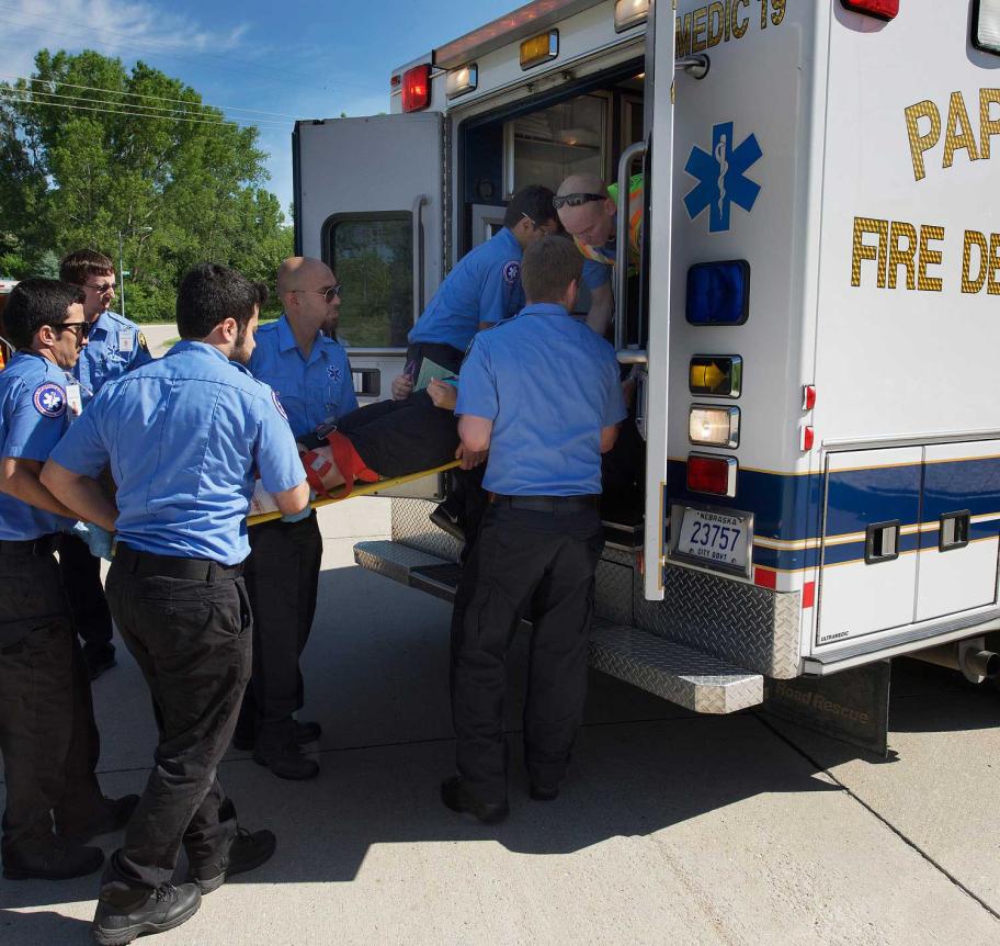 EMS associates loading patient into ambulance