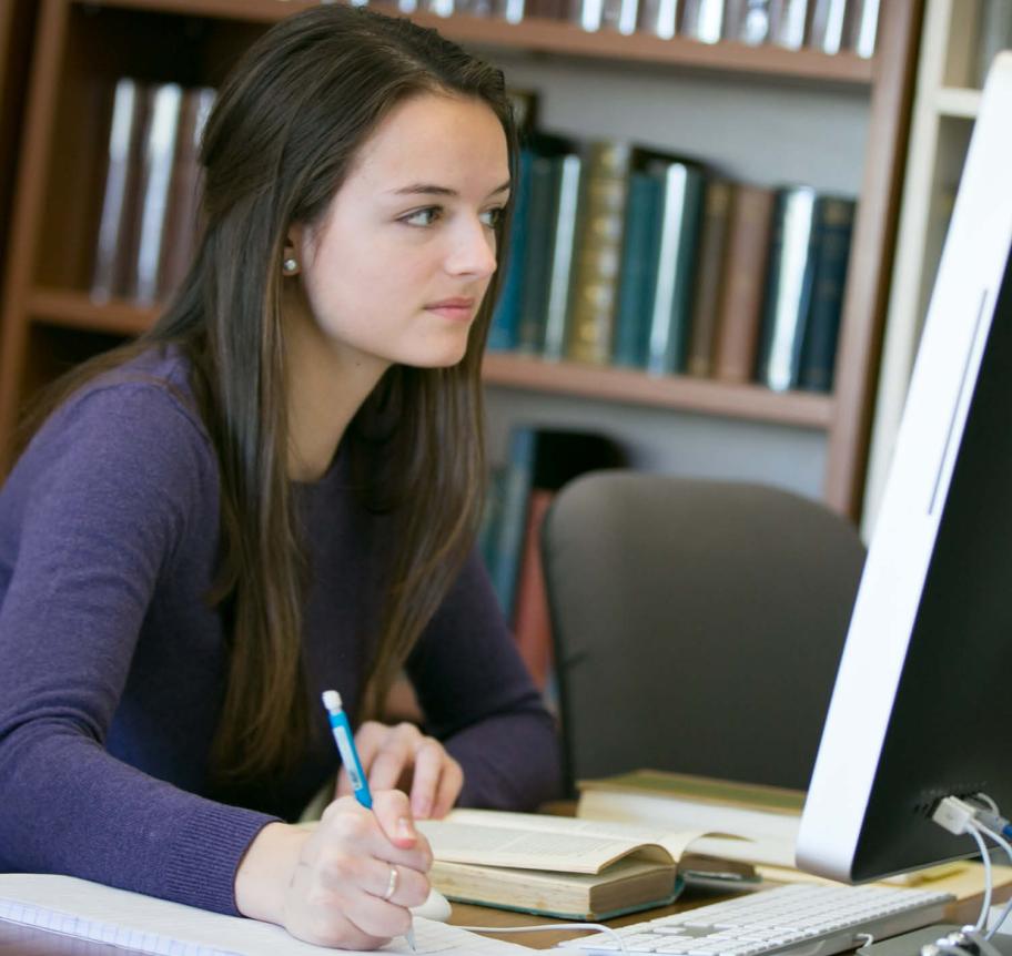 Student studying in library Thumbnail