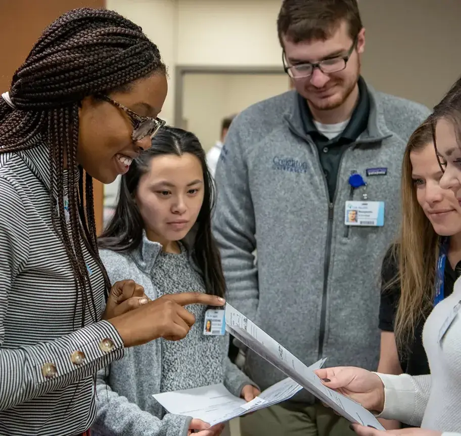 Students studying information in experiential learning setting.
