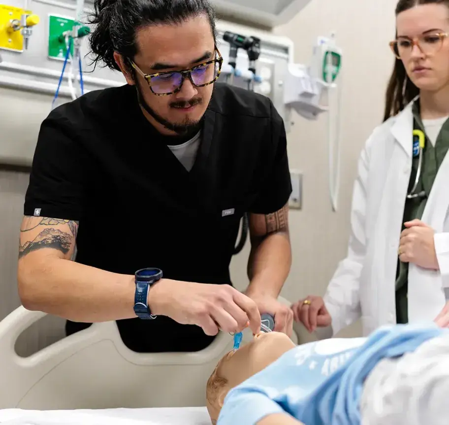 EMT practicing patient care.