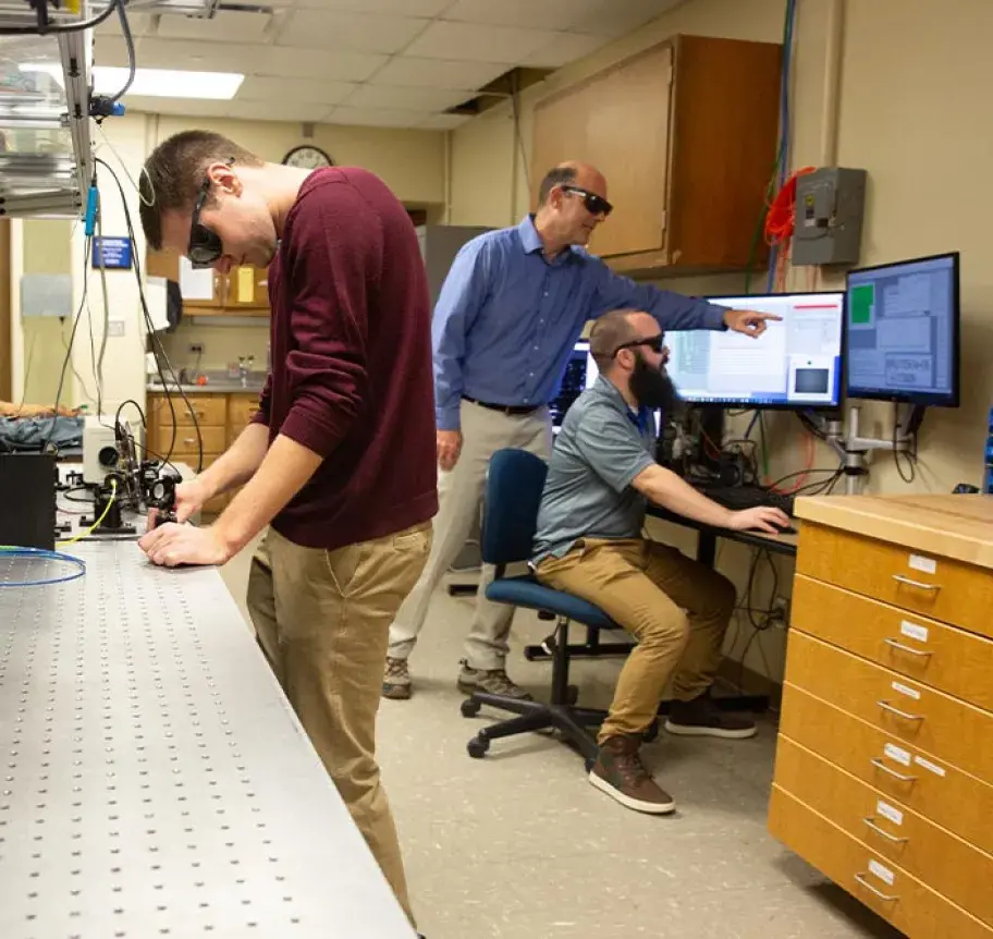 2 male students in lab with Dr. Wrubel