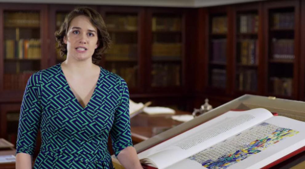 Video thumbnail featuring Hannah Clark next to the St. John's Bible